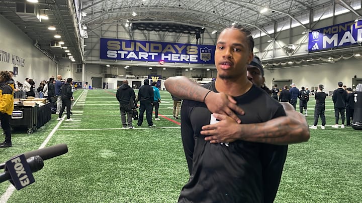 Omari Evans and Jonah Coleman share a Pro Day moment. 