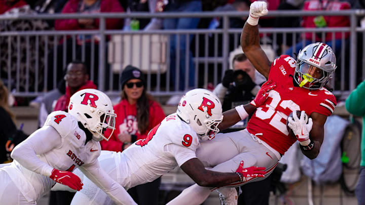 Ohio State Buckeyes running back Isaiah West (32) is pushed out of bounds by Rutgers Scarlet Knights defensive back Jett Elad (9) in the second half of the NCAA football game at Ohio Stadium on Saturday, Nov. 22, 2025 in Columbus, Ohio. Ohio State Buckeyes running back Isaiah West (32) is pushed out of bounds by Rutgers Scarlet Knights defensive back Jett Elad (9) in the second half of the NCAA football game at Ohio Stadium on Saturday, Nov. 22, 2025 in Columbus, Ohio.