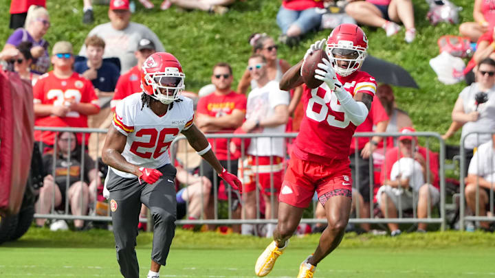 Jul 22, 2025; St. Joseph, MO, USA; Kansas City Chiefs wide receiver Jason Brownlee (89) catches a pass as safety Deon Bush (26) defends during training camp at Missouri Western State University. Mandatory Credit: Denny Medley-Imagn Images