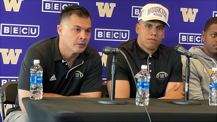 Linebacker coach Robert Bala, seated next to Taylor Mays, takes part in a media session held to introduce new program faces. 