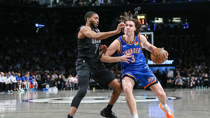 Jan 5, 2024; Brooklyn, New York, USA; Oklahoma City Thunder guard Josh Giddey (3) dribbles against Brooklyn Nets forward Mikal Bridges (1) in the third quarter at Barclays Center. Mandatory Credit: Wendell Cruz-USA TODAY Sports Jan 5, 2024; Brooklyn, New York, USA; Oklahoma City Thunder guard Josh Giddey (3) dribbles against Brooklyn Nets forward Mikal Bridges (1) in the third quarter at Barclays Center. Mandatory Credit: Wendell Cruz-USA TODAY Sports