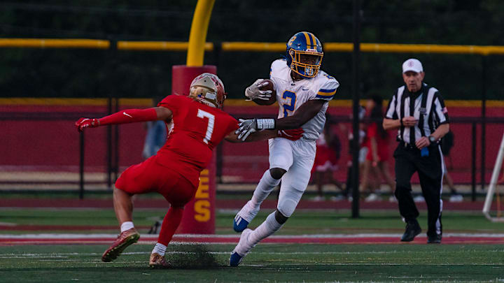 North Brunswick's Zahmir Dawud (2) runs with the ball against Edison's Michael Strachan (7) on Friday, Sept. 9, 2022, at Edison high school football field.

North Brunswick At Edison 9 9 22 5