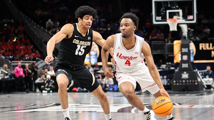 Mar 13, 2025; Kansas City, MO, USA; Houston Cougars guard L.J. Cryer (4) drives to the basket around Colorado Buffaloes guard Felix Kossaras (15) during the first half at T-Mobile Center. Mandatory Credit: William Purnell-Imagn Images