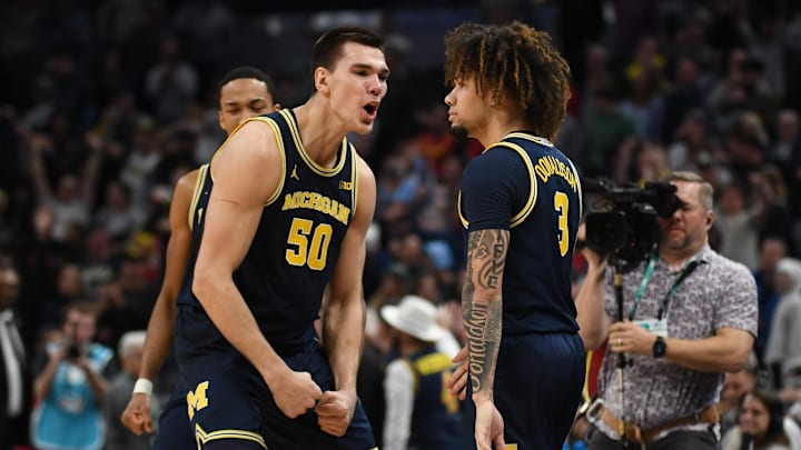 Mar 15, 2025; Indianapolis, IN, USA; Michigan Wolverines center Vladislav Goldin (50) celebrates with Michigan Wolverines guard Tre Donaldson (3) after Donaldson made a game-winning layup with .4 seconds left during the second half against the Maryland Terrapins at Gainbridge Fieldhouse. Mandatory Credit: Robert Goddin-Imagn Images
