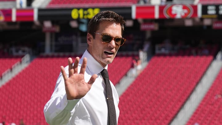 Oct 6, 2024; Santa Clara, California, USA; Fox color commentator Tom Brady gestures before the game between the San Francisco 49ers and the Arizona Cardinals at Levi's Stadium. Mandatory Credit: Darren Yamashita-Imagn Images Oct 6, 2024; Santa Clara, California, USA; Fox color commentator Tom Brady gestures before the game between the San Francisco 49ers and the Arizona Cardinals at Levi's Stadium. Mandatory Credit: Darren Yamashita-Imagn Images