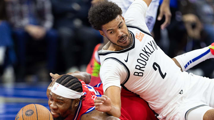 Nov 22, 2024; Philadelphia, Pennsylvania, USA; Brooklyn Nets forward Cameron Johnson (2) and Philadelphia 76ers forward Guerschon Yabusele (28) dive for a loose ball during the first quarter at Wells Fargo Center. Mandatory Credit: Bill Streicher-Imagn Images