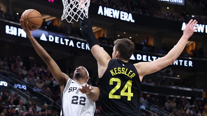 Mar 27, 2024; Salt Lake City, Utah, USA; San Antonio Spurs guard Malaki Branham (22) goes to the basket against Utah Jazz center Walker Kessler (24) during the fourth quarter at Delta Center.
