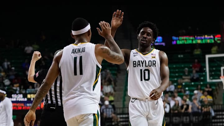Dec 28, 2021; Waco, Texas, USA;  Baylor Bears guard James Akinjo (11) and guard Adam Flagler (10)