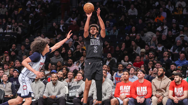 Feb 5, 2025; Brooklyn, New York, USA;  Brooklyn Nets forward Cameron Johnson (2) takes a three-point shot past Washington Wizards forward Kyshawn George (18) in the third quarter at Barclays Center. Mandatory Credit: Wendell Cruz-Imagn Images