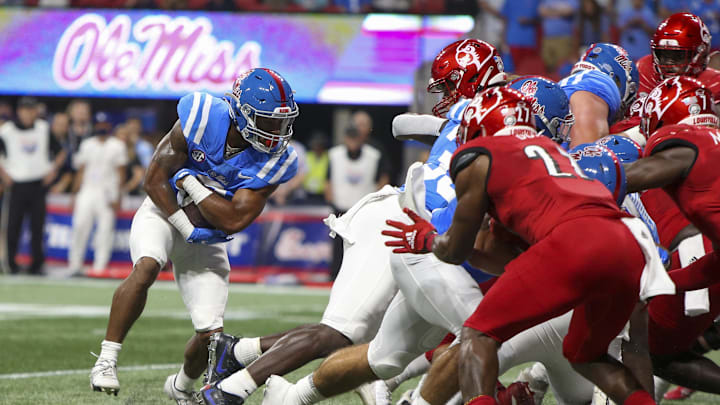 Sep 6, 2021; Atlanta, Georgia, USA; Mississippi Rebels running back Jerrion Ealy (9) scores a touchdown against the Louisville Cardinals in the first quarter at Mercedes-Benz Stadium. Mandatory Credit: Brett Davis-Imagn Images
