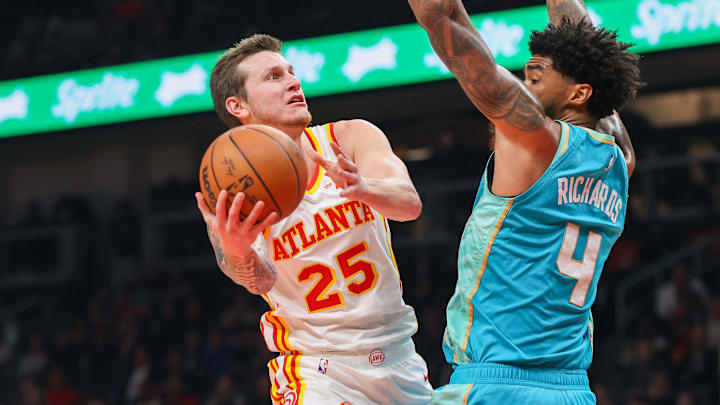Mar 23, 2024; Atlanta, Georgia, USA; Atlanta Hawks guard Garrison Mathews (25) shoots past Charlotte Mar 23, 2024; Atlanta, Georgia, USA; Atlanta Hawks guard Garrison Mathews (25) shoots past Charlotte