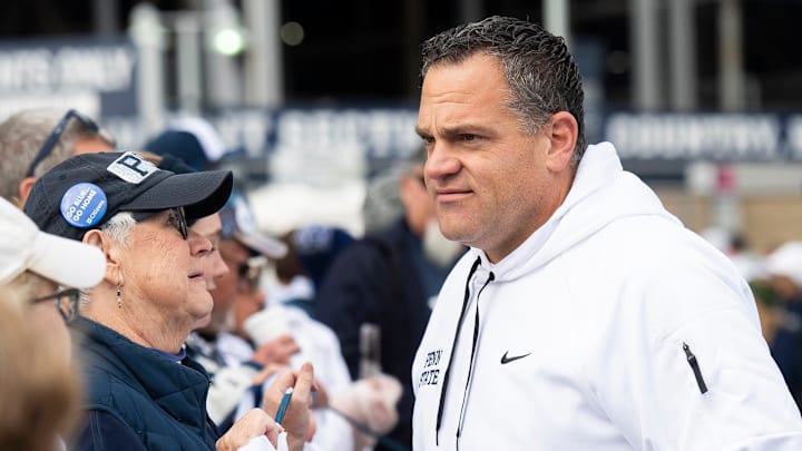 Penn State athletic director Pat Kraft talks with members of an alumni group outside of Beaver Stadium before an NCAA football game against Michigan Saturday, Nov. 11, 2023, in State College, Pa.