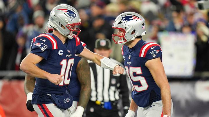 Jan 11, 2026; Foxborough, MA, USA; New England Patriots tight end Hunter Henry (85) celebrates with New England Patriots quarterback Drake Maye (10) after scoring a touchdown during the fourth quarter against the Los Angeles Chargers in an AFC Wild Card Round game at Gillette Stadium. Mandatory Credit: David Butler II-Imagn Images