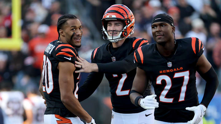 Nov 23, 2025; Cincinnati, Ohio, USA; Cincinnati Bengals place kicker Evan McPherson (2) celebrates with cornerback DJ Turner II (20) after kicking a field goal during the first half against the New England Patriots at Paycor Stadium. Mandatory Credit: Joseph Maiorana-Imagn Images