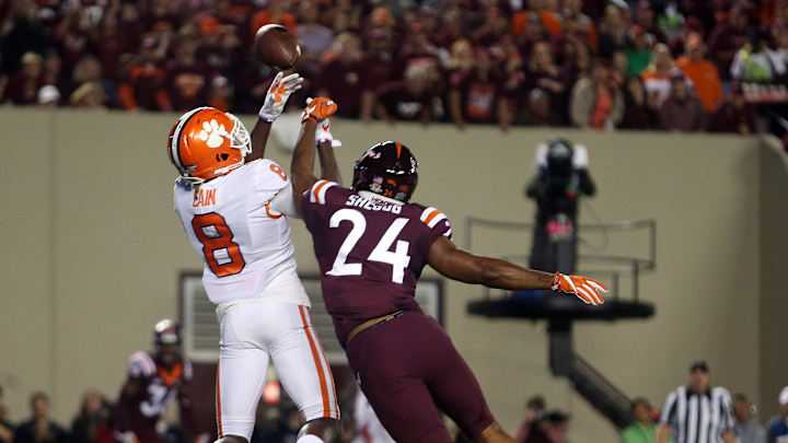 Sep 30, 2017; Blacksburg, VA, USA; Virginia Tech Hokies linebacker Anthony Shegog (24) breaks up a pass for Virginia Tech Hokies wide receiver Phil Patterson (8) during the first quarter at Lane Stadium. Mandatory Credit: Peter Casey-Imagn Images