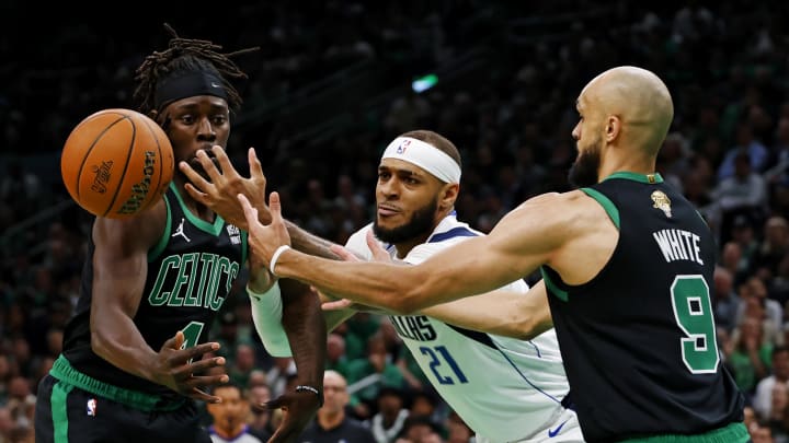 Jun 9, 2024; Boston, Massachusetts, USA; Dallas Mavericks center Daniel Gafford (21) goes for a loose ball against Boston Celtics guard Jrue Holiday (4) and guard Derrick White (9) during game two of the 2024 NBA Finals at TD Garden. Mandatory Credit: Peter Casey-USA TODAY Sports Jun 9, 2024; Boston, Massachusetts, USA; Dallas Mavericks center Daniel Gafford (21) goes for a loose ball against Boston Celtics guard Jrue Holiday (4) and guard Derrick White (9) during game two of the 2024 NBA Finals at TD Garden. Mandatory Credit: Peter Casey-USA TODAY Sports