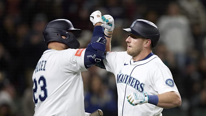 Seattle Mariners first baseman Luke Raley, right, is greeted at home by Seattle Mariners designated hitter Rowdy Tellez (23) after hitting a solo home run against the Detroit Tigers during the fourth inning at T-Mobile Park on March 31 Seattle Mariners first baseman Luke Raley, right, is greeted at home by Seattle Mariners designated hitter Rowdy Tellez (23) after hitting a solo home run against the Detroit Tigers during the fourth inning at T-Mobile Park on March 31
