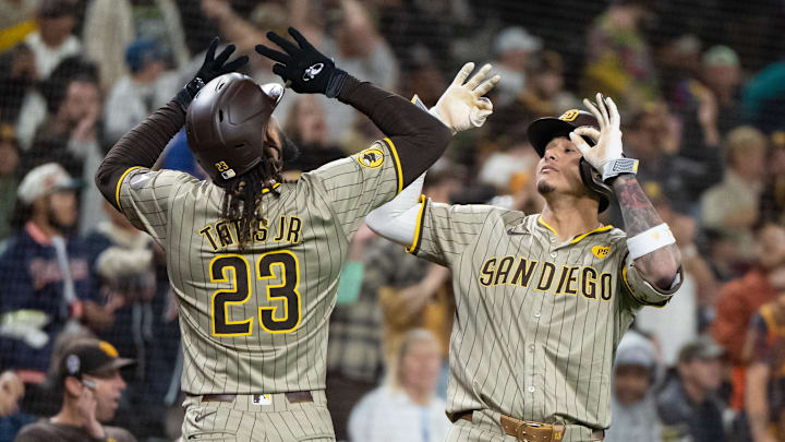Sep 11, 2024; Seattle, Washington, USA; San Diego Padres right fielder Fernando Tatis Jr. (23) celebrates with third baseman Manny Machado (13) after hitting a solo home run during the seventh inning against the Seattle Mariners at T-Mobile Park. Mandatory Credit: Stephen Brashear-Imagn Images Sep 11, 2024; Seattle, Washington, USA; San Diego Padres right fielder Fernando Tatis Jr. (23) celebrates with third baseman Manny Machado (13) after hitting a solo home run during the seventh inning against the Seattle Mariners at T-Mobile Park. Mandatory Credit: Stephen Brashear-Imagn Images