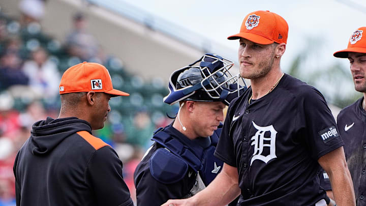 Detroit Tigers pitcher Matt Manning hands the ball to bench coach George Lombard during the fourth inning of a Grapefruit League game at Joker Marchant Stadium in Lakeland, Fla. on Saturday, Feb. 22, 2025.
