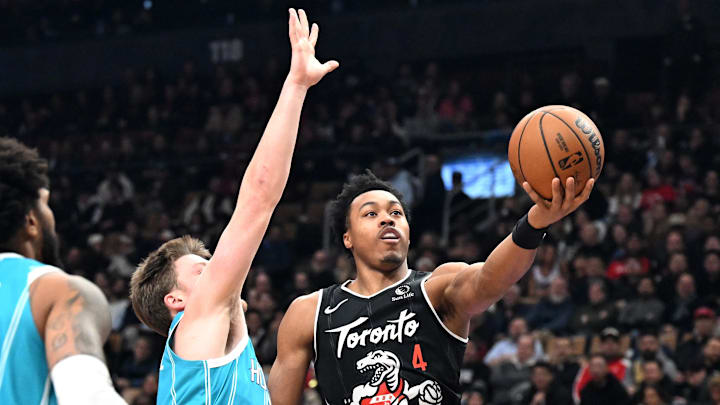 Raptors forward Scottie Barnes shoots the ball against Hornets forward Kon Kneuppel.