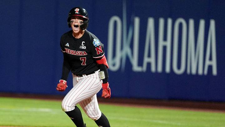 Nebraska's Ava Kuszak (7) celebrates a walk-off home run during a Women's College World Series softball game between the Arkansas Razorbacks and the Nebraska Cornhuskers at Devon Park in Oklahoma City, May 28, 2026.
