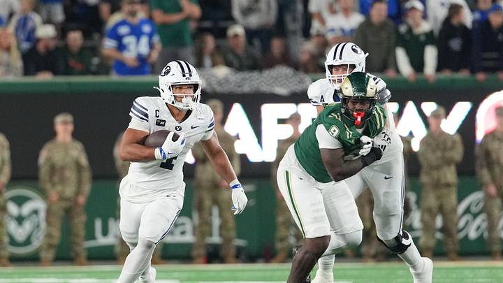 Sep 19, 2026; Fort Collins, Colorado, USA; BYU Cougars running back Lj Martin (4) runs the ball past Colorado State Rams defensive lineman Stephon Wright (9) at Sonny Lubick Field at Canvas Stadium. Mandatory Credit: Andrew Rydland-Imagn Images Sep 19, 2026; Fort Collins, Colorado, USA; BYU Cougars running back Lj Martin (4) runs the ball past Colorado State Rams defensive lineman Stephon Wright (9) at Sonny Lubick Field at Canvas Stadium. Mandatory Credit: Andrew Rydland-Imagn Images