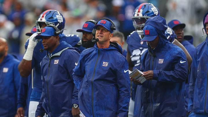 Sep 27, 2026; East Rutherford, New Jersey, USA; New York Giants head coach John Harbaugh, center, looks on during the second half against the Tennessee Titans at MetLife Stadium. Mandatory Credit: Vincent Carchietta-Imagn Images Sep 27, 2026; East Rutherford, New Jersey, USA; New York Giants head coach John Harbaugh, center, looks on during the second half against the Tennessee Titans at MetLife Stadium. Mandatory Credit: Vincent Carchietta-Imagn Images