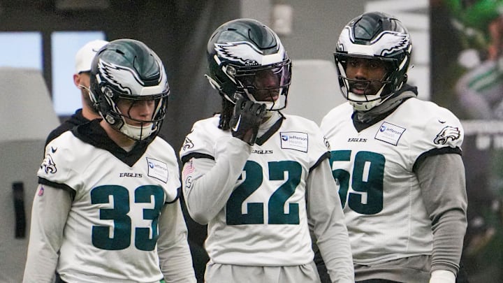 Defensive back Cooper DeJean (33) and cornerback Kelee Ringo (22) take part in warmups with defensive tackle Thomas Booker as the Philadelphia Eagles work out in preparation for the Super Bowl at the NovaCare Complex in Philadelphia on Jan. 31, 2025.