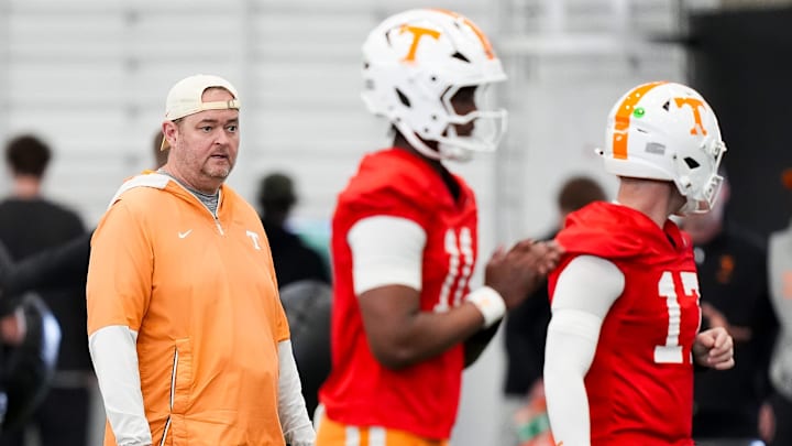 Tennessee coach Josh Heupel with the quarterbacks during the Vols' spring football practice in Knoxville on March 17, 2026.
