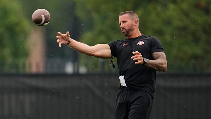 Ohio State Buckeyes offensive coordinator Brian Hartline throws during the first football practice of the season at the Woody Hayes Athletic Center on July 31, 2025.
