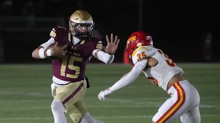 Iona Prep's Julian Guzman straight-arms Chaminade's Anthony Trapani Oct. 25, 2024. Iona Prep won 28-7.