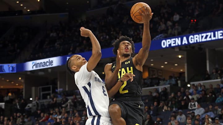 Nov 29, 2023; Memphis, Tennessee, USA; Utah Jazz guard Collin Sexton (2) drives to the basket as Memphis Grizzlies forward Ziaire Williams (8) defends during the second half at FedExForum. Mandatory Credit: Petre Thomas-Imagn Images