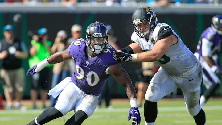 Sep 25, 2016; Jacksonville, FL, USA;  Jacksonville Jaguars offensive guard Luke Joeckel (76) blocks Baltimore Ravens linebacker Za'Darius Smith (90) during the second half of a football game at EverBank FieldThe Baltimore Ravens won 19-17. Mandatory Credit: Reinhold Matay-Imagn Images