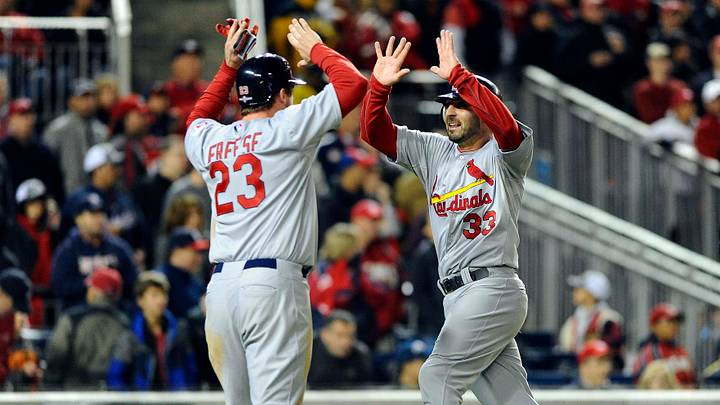 Oct 12, 2012; Washington, DC, USA; St. Louis Cardinals third baseman David Freese (23) and second baseman Daniel Descalso (33) celebrate after scoring in the ninth inning against the Washington Nationals in game five of the 2012 NLDS at Nationals Park. Mandatory Credit: Brad Mills-USA TODAY Sports Oct 12, 2012; Washington, DC, USA; St. Louis Cardinals third baseman David Freese (23) and second baseman Daniel Descalso (33) celebrate after scoring in the ninth inning against the Washington Nationals in game five of the 2012 NLDS at Nationals Park. Mandatory Credit: Brad Mills-USA TODAY Sports