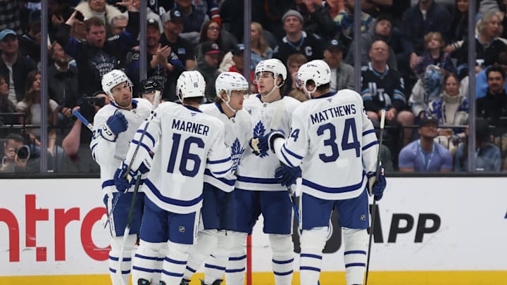 Mar 10, 2025; Salt Lake City, Utah, USA; Toronto Maple Leafs right wing William Nylander (middle) celebrates a goal on a power play against the Utah Hockey Club during the first period at Delta Center. Mandatory Credit: Rob Gray-Imagn Images