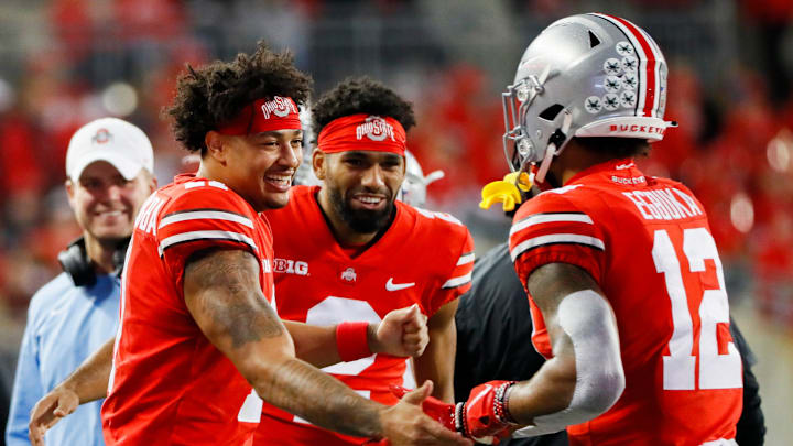 Ohio State Buckeyes wide receiver Jaxon Smith-Njigba (11) and Ohio State Buckeyes wide receiver Chris Olave (2) congratulate Ohio State Buckeyes wide receiver Emeka Egbuka (12) after a long run during the third quarter of a  NCAA Division I football game between the Ohio State Buckeyes and the Akron Zips on Saturday, Sept. 25, 2021 at Ohio Stadium in Columbus, Ohio.

Cfb Akron Zips At Ohio State Buckeyes