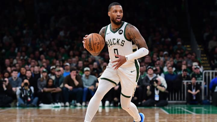 Dec 6, 2024; Boston, Massachusetts, USA;  Milwaukee Bucks guard Damian Lillard (0) controls the ball during the first half against the Boston Celtics at TD Garden. Mandatory Credit: Bob DeChiara-Imagn Images