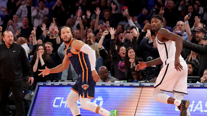 Nov 15, 2024; New York, New York, USA; New York Knicks guard Jalen Brunson (11) celebrates his game winning three point shot against Brooklyn Nets forward Dorian Finney-Smith (28) during the fourth quarter at Madison Square Garden. Mandatory Credit: Brad Penner-Imagn Images