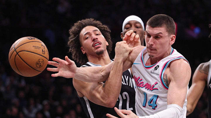 Feb 7, 2025; Brooklyn, New York, USA; Miami Heat guard Tyler Herro (14) battles Brooklyn Nets forward Jalen Wilson (22) for a rebound during the first half at Barclays Center. Mandatory Credit: Vincent Carchietta-Imagn Images Feb 7, 2025; Brooklyn, New York, USA; Miami Heat guard Tyler Herro (14) battles Brooklyn Nets forward Jalen Wilson (22) for a rebound during the first half at Barclays Center. Mandatory Credit: Vincent Carchietta-Imagn Images
