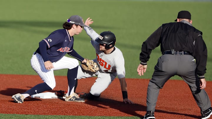 Oregon State Beavers outfielder Justin Boyd (4) is tagged out.