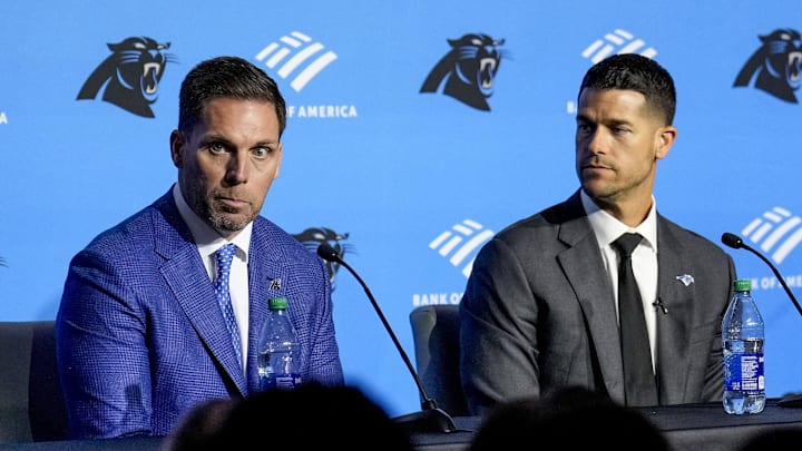 Feb 1, 2024; Charlotte, NC, USA; Carolina Panthers general manager Dan Morgan (left) speaks with new coach Dave Canales during the introductory press conference at Bank of America Stadium. Mandatory Credit: Jim Dedmon-Imagn Images