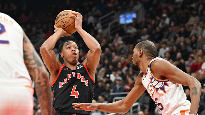 Feb 23, 2025; Toronto, Ontario, CAN; Toronto Raptors forward Scottie Barnes (4) shoots the ball as Phoenix Suns forward Kevin Durant (35) defends in the first half at Scotiabank Arena. Mandatory Credit: Dan Hamilton-Imagn Images