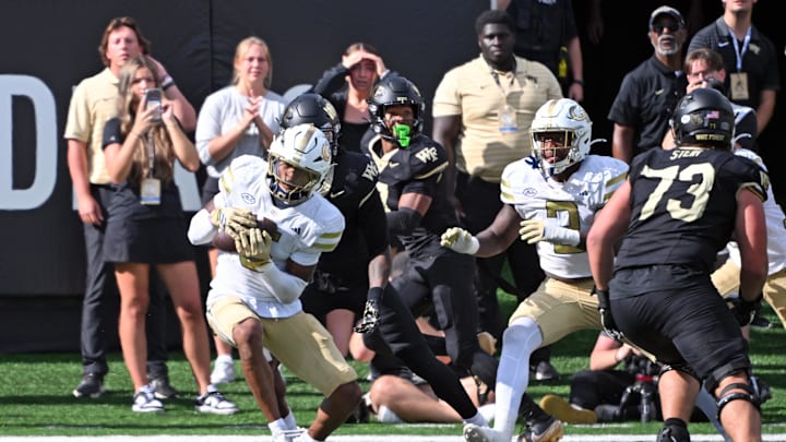 Sep 27, 2025; Winston-Salem, North Carolina, USA; Georgia Tech Yellow Jackets defensive back Clayton Powell-Lee (5) intercepts the ball in overtime against the Wake Forest Demon Deacons at Allegacy Federal Credit Union Stadium. Yellow Jackets win 30-29 Mandatory Credit: Zachary Taft-Imagn Images Sep 27, 2025; Winston-Salem, North Carolina, USA; Georgia Tech Yellow Jackets defensive back Clayton Powell-Lee (5) intercepts the ball in overtime against the Wake Forest Demon Deacons at Allegacy Federal Credit Union Stadium. Yellow Jackets win 30-29 Mandatory Credit: Zachary Taft-Imagn Images