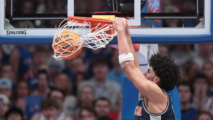 Arizona Wildcats forward Koa Peat (10) dunks the ball against Kansas Jayhawks during the game inside Allen Fieldhouse on Feb. 9, 2026.
