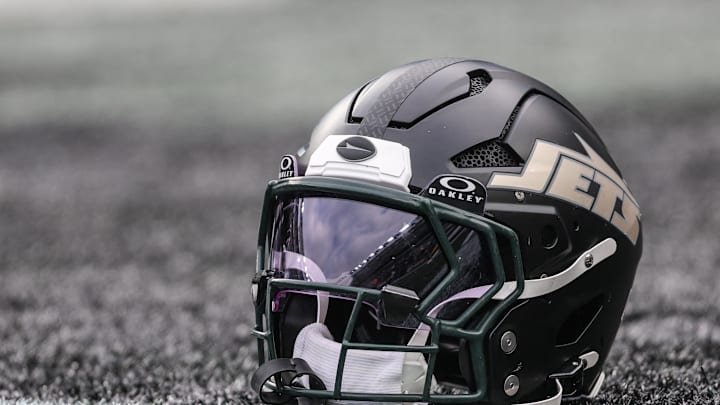 Dec 7, 2025; East Rutherford, New Jersey, USA; A general view of a Gotham City football rivalries helmet resting on the field before the game against the Miami Dolphins at MetLife Stadium. Mandatory Credit: Vincent Carchietta-Imagn Images