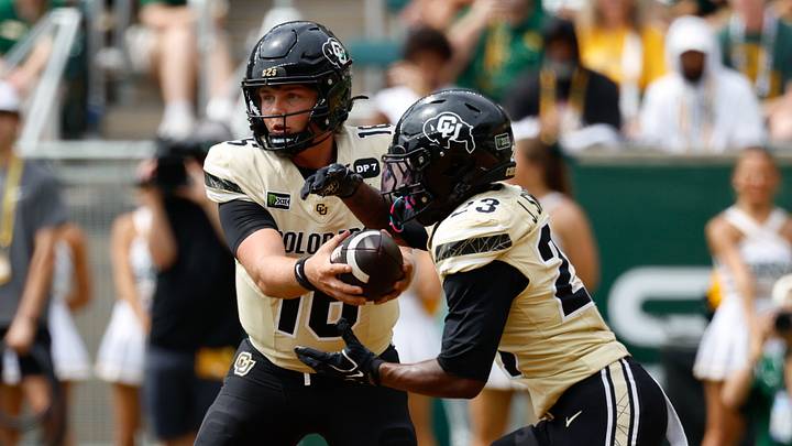 Sep 26, 2026; Waco, Texas, USA;  Colorado Buffaloes quarterback Isaac Wilson (16) hands the ball off to running back JaQuail Smith (23) during the second half against the Baylor Bears at McLane Stadium.  Mandatory Credit: Chris Jones-Imagn Images
