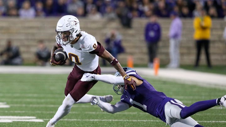 Nov 16, 2024; Manhattan, Kansas, USA; Arizona State Sun Devils wide receiver Jordyn Tyson (0) tries break free from Kansas State Wildcats cornerback Keenan Garber (1) during the first quarter at Bill Snyder Family Football Stadium. Mandatory Credit: Scott Sewell-Imagn Images