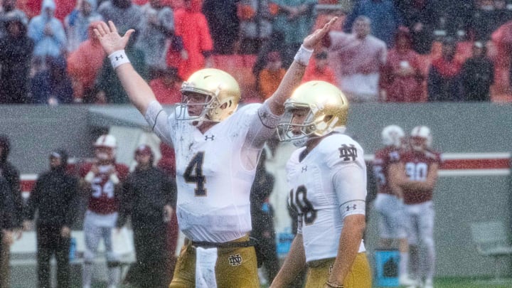 Oct 8, 2016; Raleigh, NC, USA; Notre Dame Fighting Irish holder Montgomery VanGorder (4) reacts after kicker Justin Yoon (19) kicked a field goal in the third quarter against the North Carolina State Wolfpack at Carter-Finley Stadium. 