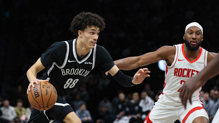 Jan 1, 2026; Brooklyn, New York, USA; Brooklyn Nets guard Nolan Traore (88) dribbles during the first half against the Houston Rockets at Barclays Center. Mandatory Credit: Vincent Carchietta-Imagn Images