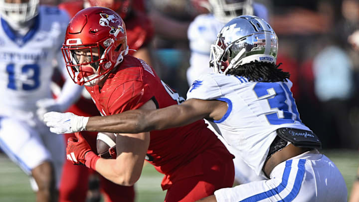 Nov 25, 2023; Louisville, Kentucky, USA; Louisville Cardinals tight end Nate Kurisky (85) runs the ball against Kentucky Wildcats defensive back Maxwell Hairston (31) during the second half at L&N Federal Credit Union Stadium. Kentucky defeated Louisville 38-31. 